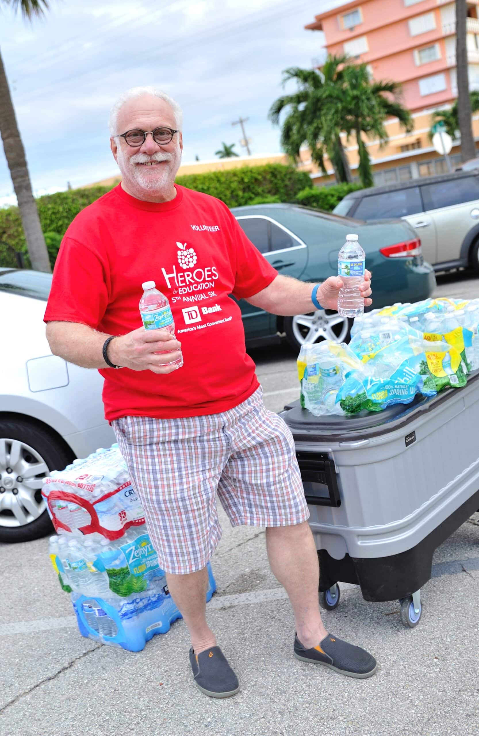 Alan Baseman handing out water